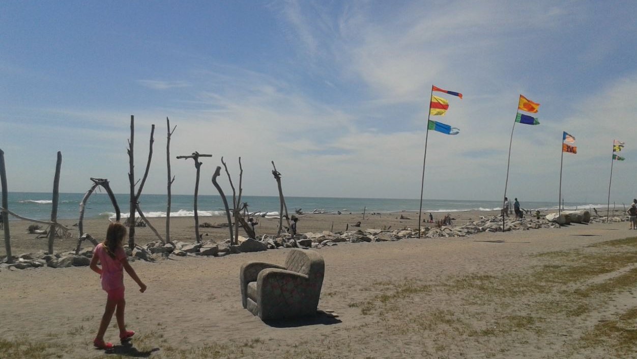 Driftwood & Sand: girl, flags, seat, sign