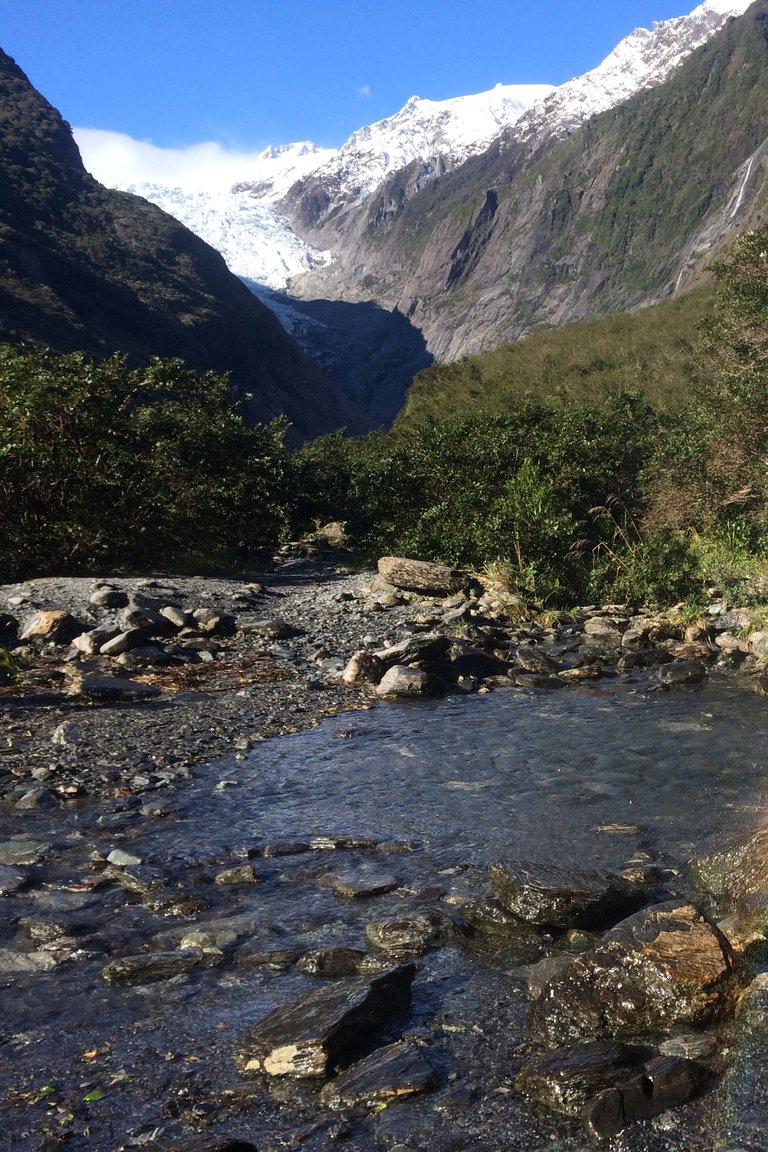 Rainbows in Trident Falls waterfall in the Franz Josef Glacier Valley